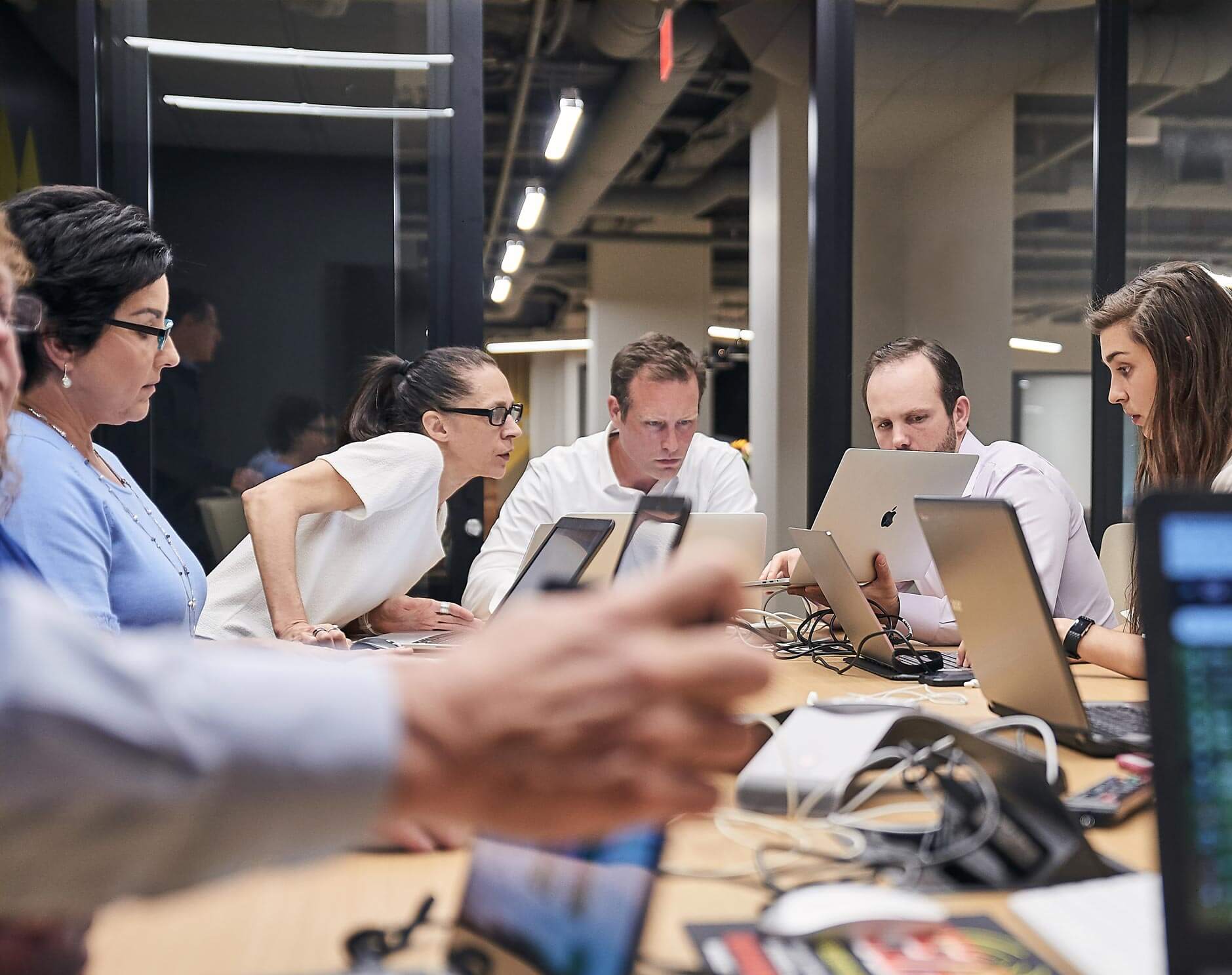 team looking at a result on computers together