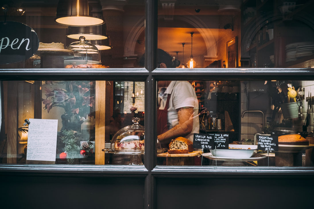 Woman working in bakery wearing apron